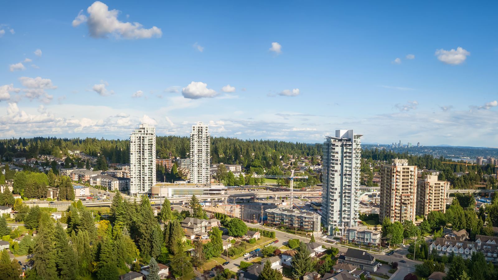 Aerial view of highrise towers near Burquitlam beside single-family streets